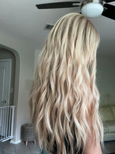 Load image into Gallery viewer, Lucy is a 25” layered length, small cap made with premium Brazilian quality human hair