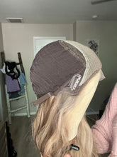 Load image into Gallery viewer, Gianna is a 25” layered length, medium cap made with premium Brazilian quality human hair