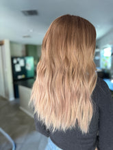 Load image into Gallery viewer, Izzy is a 20” layered length with face frame, medium cap made with premium Brazilian quality human hair