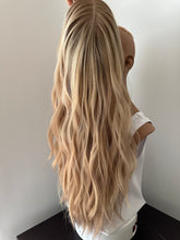 Load image into Gallery viewer, Lucy is a 25” layered length, small cap made with premium Brazilian quality human hair