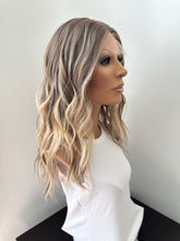 Load image into Gallery viewer, Liv is a 19” layered length with face frame, small cap made with premium Euro quality human hair