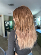 Load image into Gallery viewer, Izzy is a 20” layered length with face frame, medium cap made with premium Brazilian quality human hair