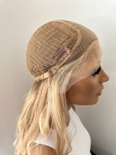Load image into Gallery viewer, Lucy is a 25” layered length, small cap made with premium Brazilian quality human hair