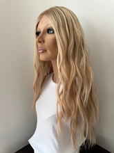 Load image into Gallery viewer, Lucy is a 25” layered length, small cap made with premium Brazilian quality human hair