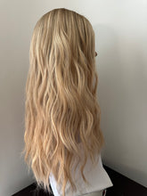 Load image into Gallery viewer, Lucy is a 25” layered length, small cap made with premium Brazilian quality human hair