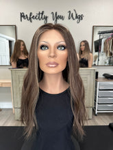 Load image into Gallery viewer, Dorothy is a 23” layered length, medium hand tied stretch cap with lace top made with premium Brazilian quality human hair