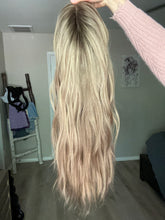 Load image into Gallery viewer, Gianna is a 25” layered length, medium cap made with premium Brazilian quality human hair