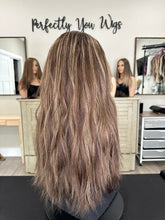 Load image into Gallery viewer, Dorothy is a 23” layered length, medium hand tied stretch cap with lace top made with premium Brazilian quality human hair