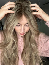 Load image into Gallery viewer, Gianna is a 25” layered length, medium cap made with premium Brazilian quality human hair