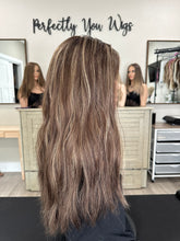 Load image into Gallery viewer, Dorothy is a 23” layered length, medium hand tied stretch cap with lace top made with premium Brazilian quality human hair