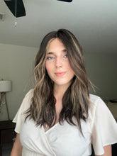 Load image into Gallery viewer, Layla is a 20” length with heavy layers, medium cap made with premium Brazilian quality human hair