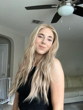 Load image into Gallery viewer, Lucy is a 25” layered length, small cap made with premium Brazilian quality human hair