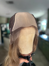 Load image into Gallery viewer, Izzy is a 20” layered length with face frame, medium cap made with premium Brazilian quality human hair