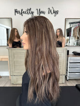 Load image into Gallery viewer, Dorothy is a 23” layered length, medium hand tied stretch cap with lace top made with premium Brazilian quality human hair