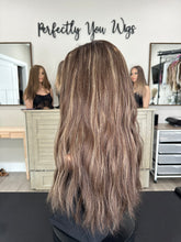 Load image into Gallery viewer, Dorothy is a 23” layered length, medium hand tied stretch cap with lace top made with premium Brazilian quality human hair