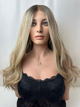 Load image into Gallery viewer, Savanna is a 22" layered length, medium cap made with premium Brazilian quality human hair