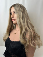 Load image into Gallery viewer, Savanna is a 22" layered length, medium cap made with premium Brazilian quality human hair