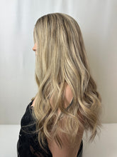 Load image into Gallery viewer, Savanna is a 22" layered length, medium cap made with premium Brazilian quality human hair