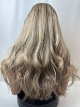 Load image into Gallery viewer, Savanna is a 22" layered length, medium cap made with premium Brazilian quality human hair