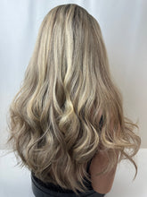 Load image into Gallery viewer, Savanna is a 22" layered length, medium cap made with premium Brazilian quality human hair