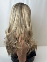 Load image into Gallery viewer, Savanna is a 22" layered length, medium cap made with premium Brazilian quality human hair