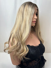 Load image into Gallery viewer, Savanna is a 22" layered length, medium cap made with premium Brazilian quality human hair