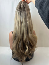 Load image into Gallery viewer, Savanna is a 22" layered length, medium cap made with premium Brazilian quality human hair