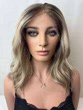 Load image into Gallery viewer, Evie is a 17" layered length, medium cap made with a premium Brazilian quality human hair