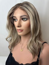 Load image into Gallery viewer, Evie is a 17" layered length, medium cap made with a premium Brazilian quality human hair