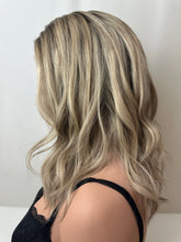 Load image into Gallery viewer, Evie is a 17" layered length, medium cap made with a premium Brazilian quality human hair