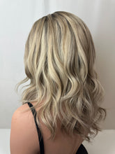 Load image into Gallery viewer, Evie is a 17" layered length, medium cap made with a premium Brazilian quality human hair