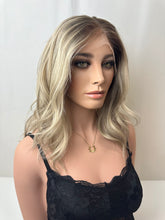 Load image into Gallery viewer, Evie is a 17" layered length, medium cap made with a premium Brazilian quality human hair