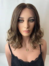 Load image into Gallery viewer, Jaxie is a 16" layered length, medium cap made with premium Brazilian quality human hair