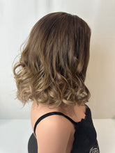 Load image into Gallery viewer, Jaxie is a 16" layered length, medium cap made with premium Brazilian quality human hair