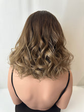 Load image into Gallery viewer, Jaxie is a 16" layered length, medium cap made with premium Brazilian quality human hair
