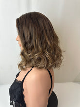 Load image into Gallery viewer, Jaxie is a 16" layered length, medium cap made with premium Brazilian quality human hair