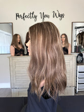 Load image into Gallery viewer, Brittany is an 18" layered length, medium cap made with premium Brazilian texture hair