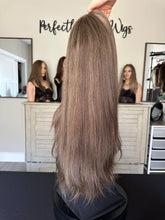 Load image into Gallery viewer, Monica is a 22" layered length, medium cap made with premium Brazilian texture hair