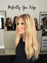 Load image into Gallery viewer, Charlie is a 21" layered length, medium cap made with premium Brazilian texture human hair