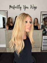 Load image into Gallery viewer, Charlie is a 21" layered length, medium cap made with premium Brazilian texture human hair