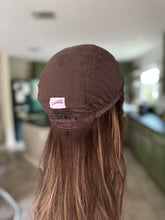 Load image into Gallery viewer, Dorothy is a large cap, 24” layered length ULTRA lightweight / low density cap made with premium Brazilian quality human hair

