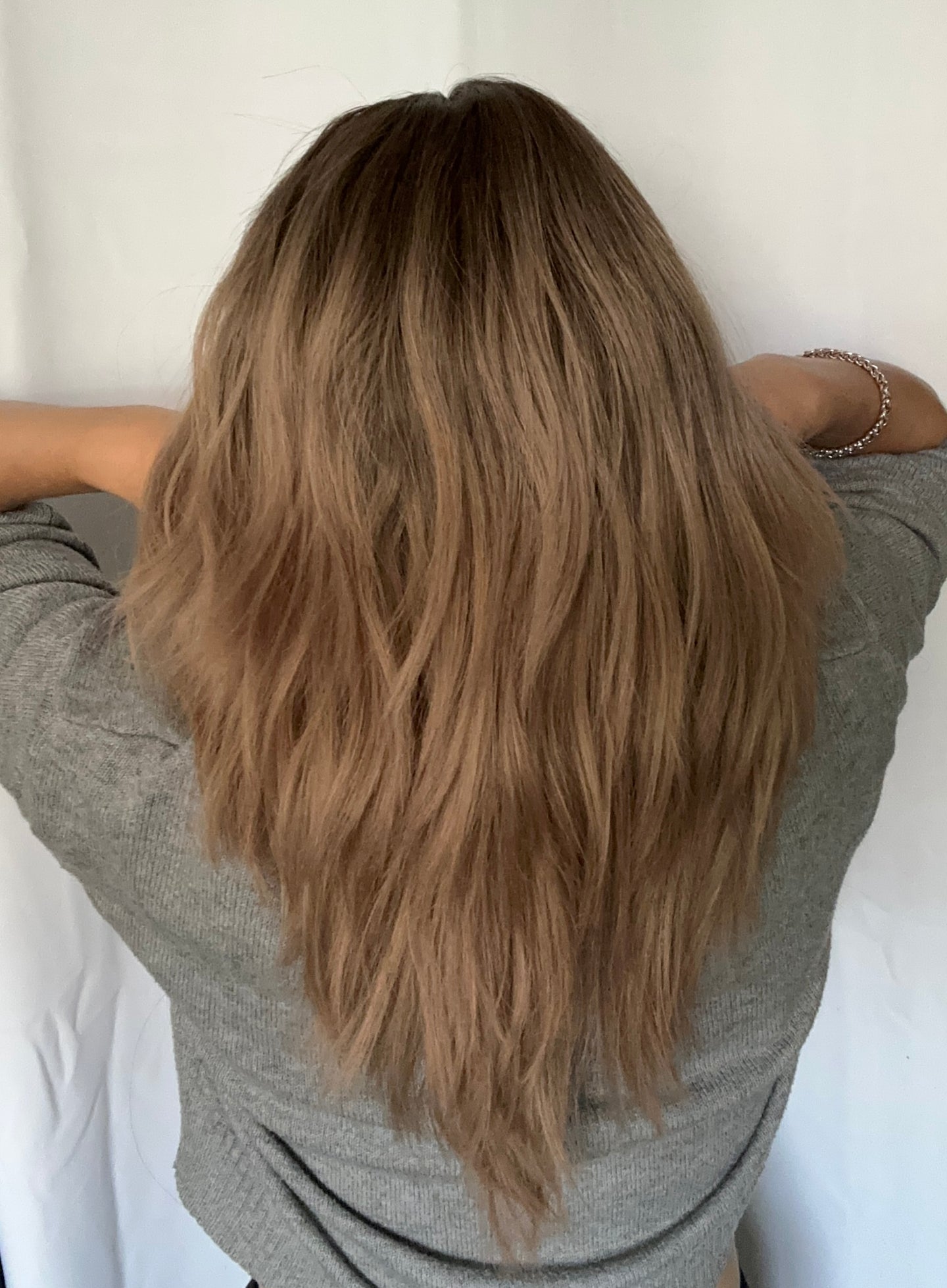 Arlie is an 18” layered length, medium cap made with premium Brazilian quality human hair