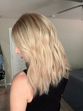 Load image into Gallery viewer, Avery is a 15” length with curtain bangs, medium cap made with premium Brazilian quality human hair
