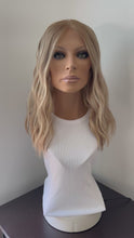 Load and play video in Gallery viewer, Lainey is a 17&quot; length, small cap made with premium Brazilian quality human hair
